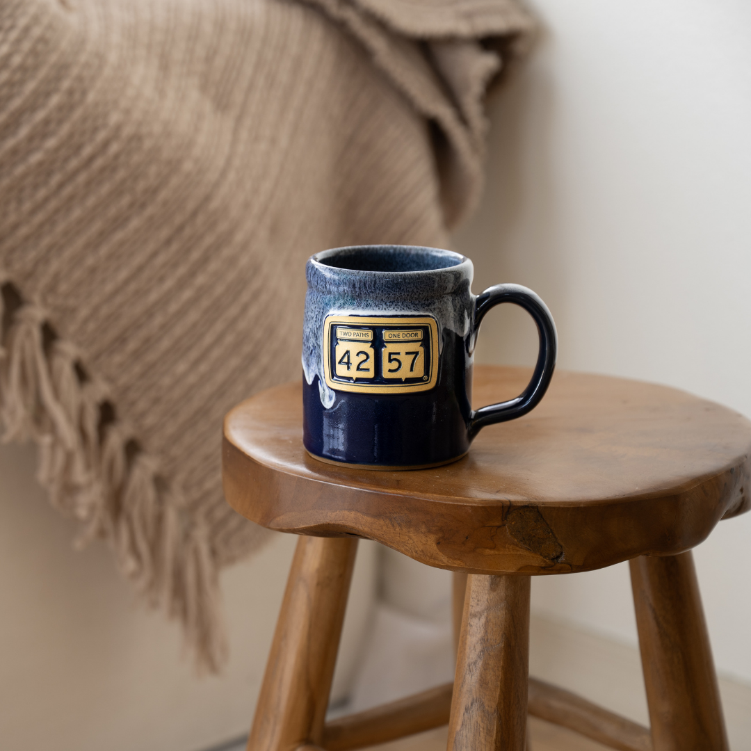 42-57 Gallery Mug in navy styled on wooden stool
