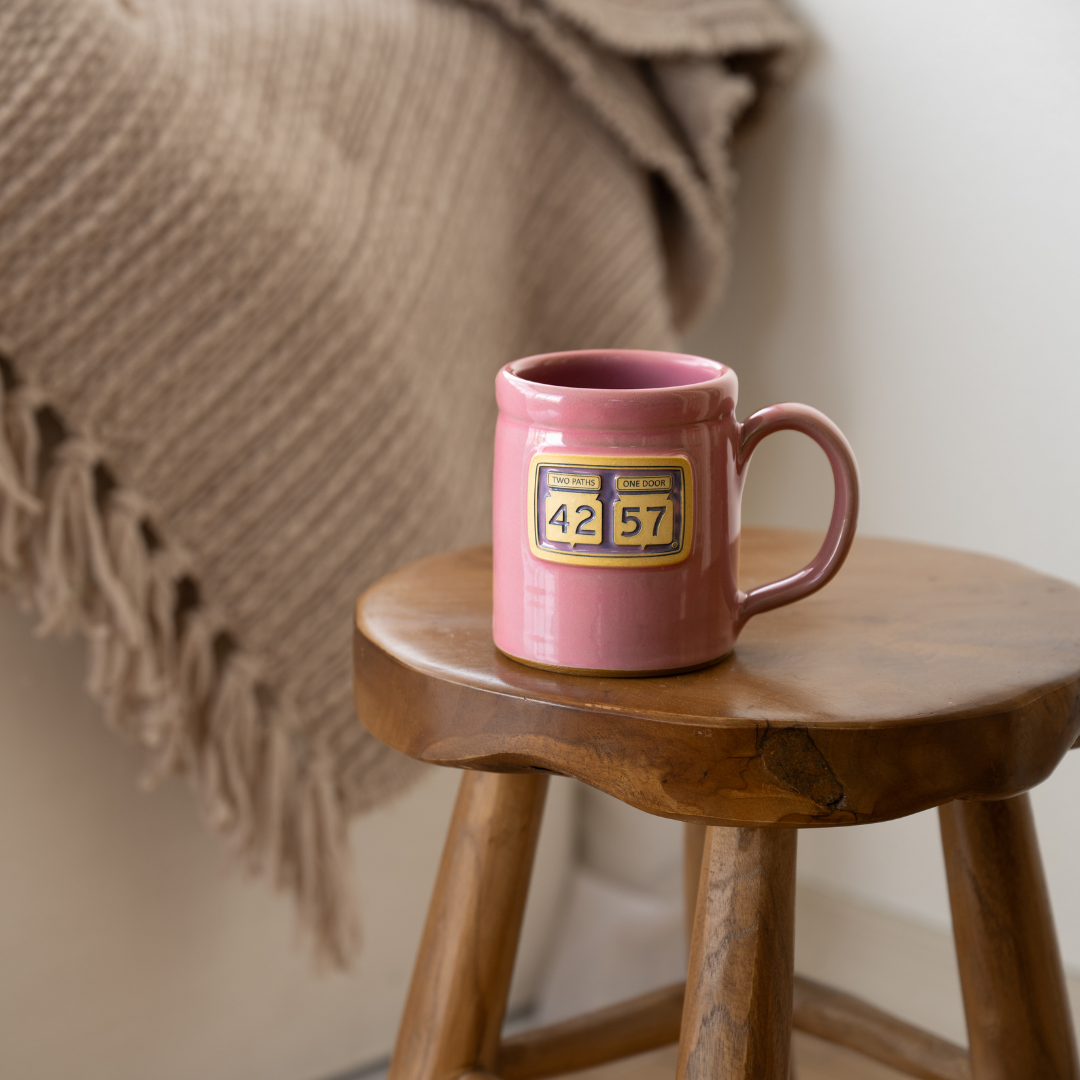 42-57 Gallery Mug in pink styled on wooden stool
