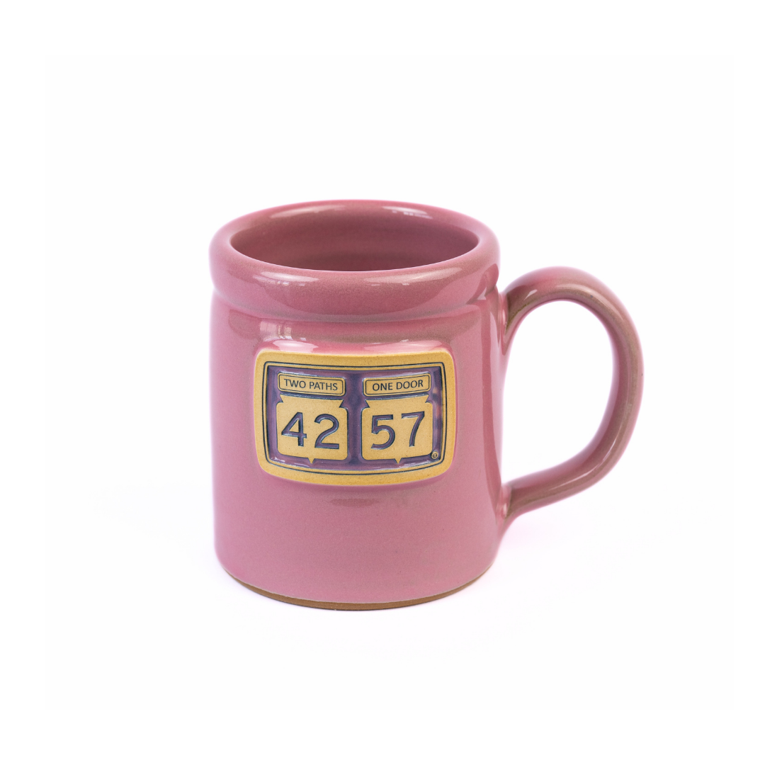 Tilted view of 42-57 Gallery Mug in pink made with handcrafted ceramic