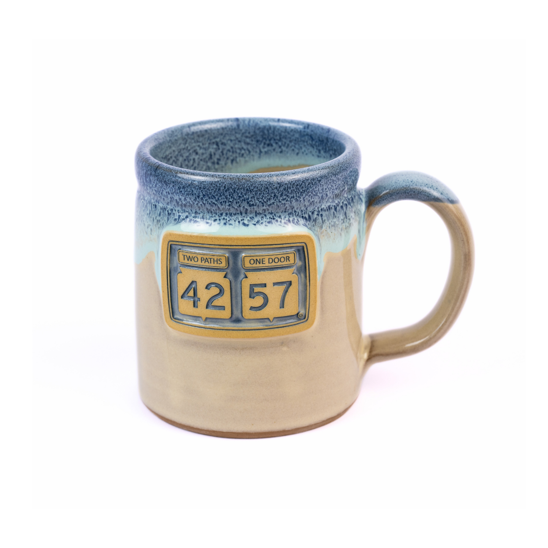 Tilted view of 42-57 Gallery Mug in beige made with handcrafted ceramic